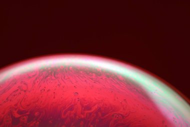 The abstact element on the soap bubble with the dark background.