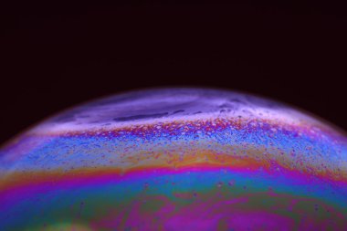 The abstact element on the soap bubble with the dark background.