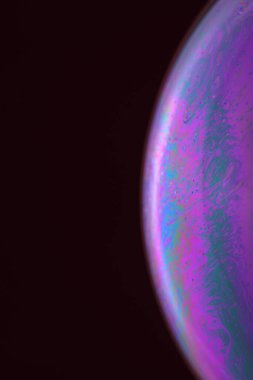 The abstact element on the soap bubble with the dark background.
