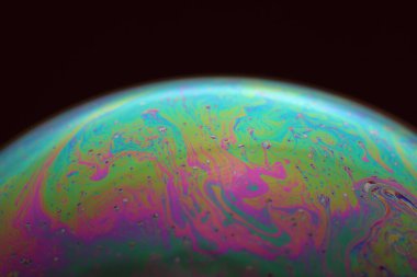 The abstact element on the soap bubble with the dark background.