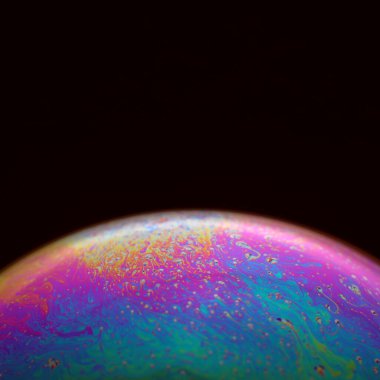 The abstact element on the soap bubble with the dark background.
