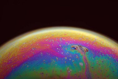 The abstact element on the soap bubble with the dark background.