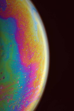 The abstact element on the soap bubble with the dark background.
