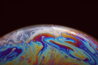 The abstact element on the soap bubble with the dark background.