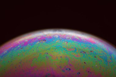 The abstact element on the soap bubble with the dark background.