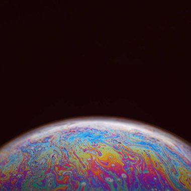 The abstact element on the soap bubble with the dark background.