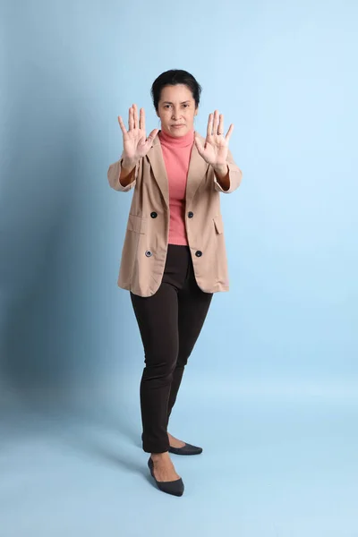 Senior Asian Woman Pink Shirt Brown Blazer Blue Background — Stock Photo, Image