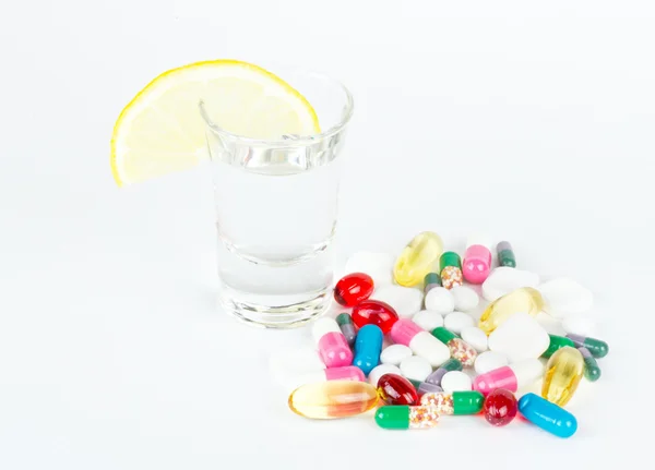 Alcohol and medicals on white — Stock Photo, Image