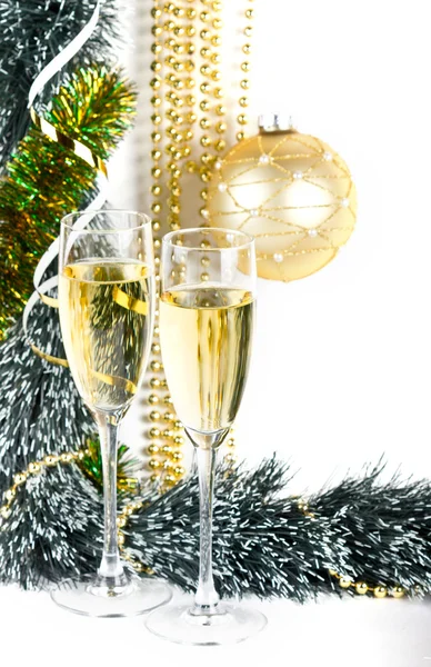 Christmas champagne glasses and golden ball on white — Stock Photo, Image