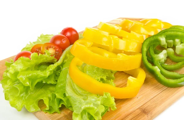 Fresh slices of pepper and tomatoes on white — Stock Photo, Image