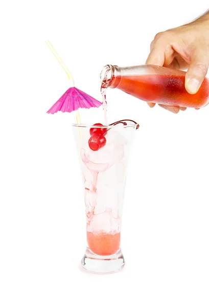 Limonada roja con paja de fiesta en la mano sobre blanco —  Fotos de Stock