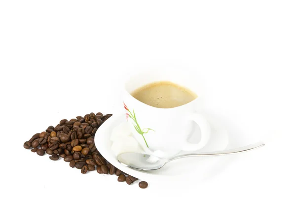 A cup of coffee with beans on white background — Stock Photo, Image