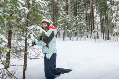 Woman outdoors at winter forest