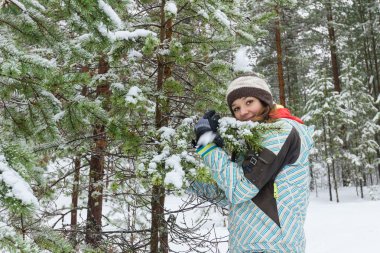 Woman outdoors at winter forest
