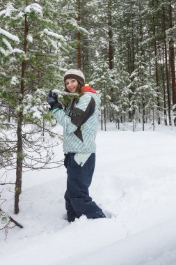 Woman outdoors at winter forest