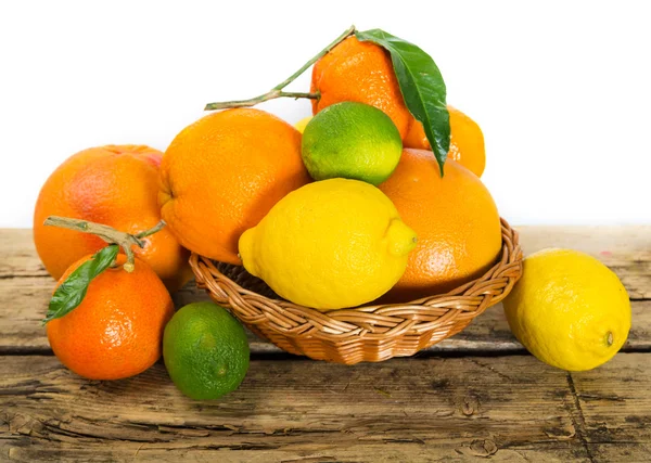 Citrus fruits on wooden background — Stock Photo, Image