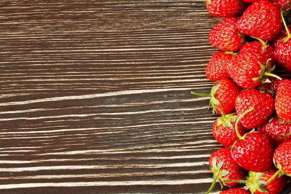 Strawberry on a wooden background — Stock Photo, Image
