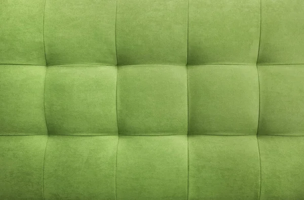 Odadaki duvar için zeytin rengi süet deri arka plan. İç tasarım, mobilya kumaşından yapılmış yatak başlıkları, mobilya döşemeleri. Mobilya, duvar, yatak başlığı için klasik dama deseni