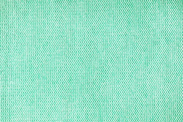 Close-up texture of natural turquoise coarse weave fabric or cloth. Fabric texture of natural cotton or linen textile material. Blue canvas background. Decorative fabric for upholstery, furniture, walls