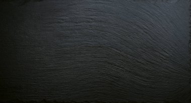 Black slate natural pattern texture background, abstract rustic matt ceramic wall and floor, kitchen dish. Wallpaper, backdrop for design, header and cover site, restaurant menu, food background