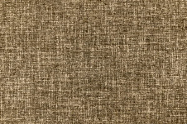 Texture of natural brown upholstery fabric or cloth. Fabric texture of natural cotton or linen textile material. Blue canvas background. Decorative fabric for curtain, furniture, walls, clothes
