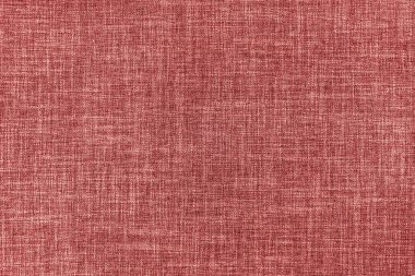 Texture of natural red upholstery fabric or cloth. Fabric texture of natural cotton or linen textile material. Canvas background. Decorative fabric for curtain, furniture, walls, clothes