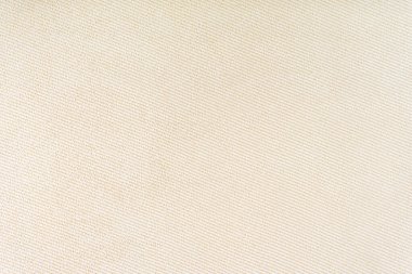 Doğal kumaş ya da kumaş dokusu. Kumaş dokusu, doğal pamuk ya da keten kumaştan çapraz dokuma. Bej rengi tuval arka plan. Perde, mobilya, duvar ve kıyafetler için dekoratif kumaş