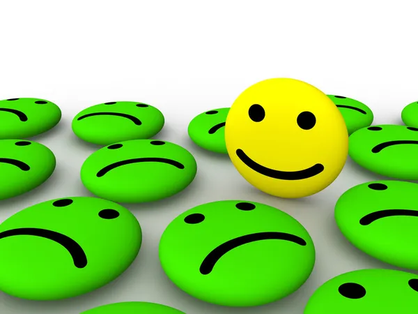 Cara sonriente feliz entre emoticonos tristes —  Fotos de Stock