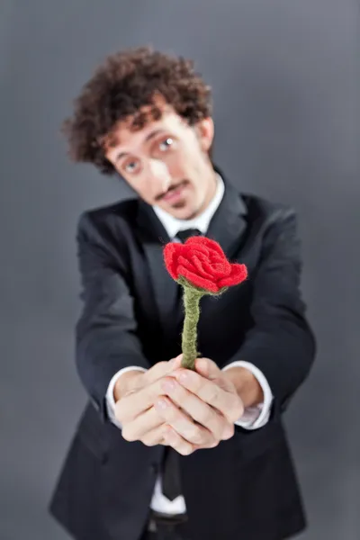 Man giving fabric rose — Stock Photo, Image