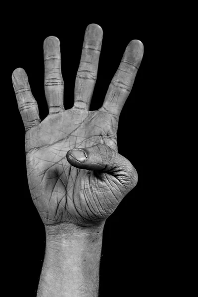 Рука на чорній долоні - чотири — стокове фото