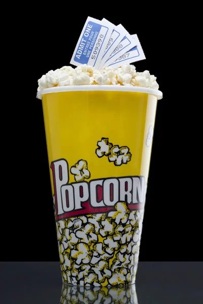 Popcorn and tickets isolated on the dark background — Stock Photo, Image