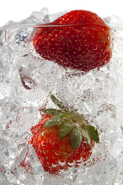 Strawberries in ice cubes — Stock Photo, Image