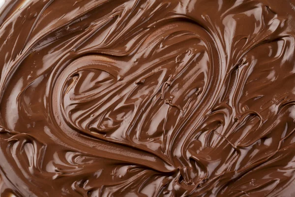 Heart shape made up of melted chocolate — Stock Photo, Image