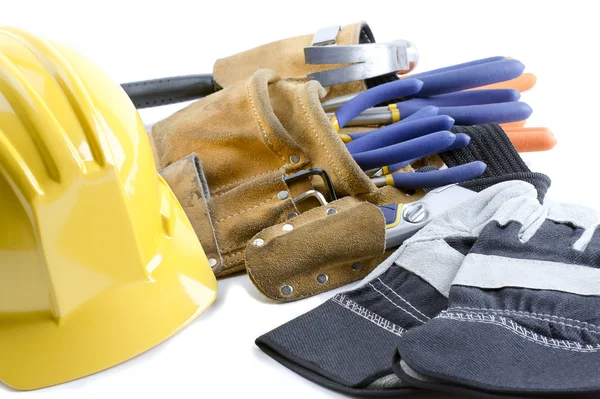 Close up shot of yellow hat gloves and tool belt — Stock Photo, Image