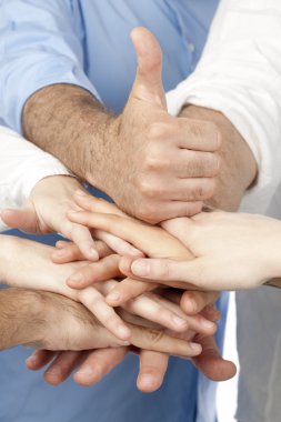 Diverse group of peoples hands together clipart