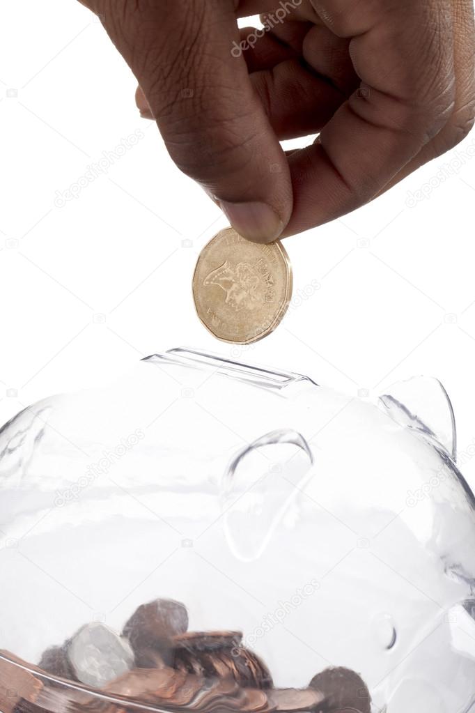 Hand dropping a coin