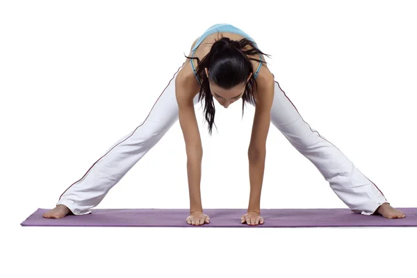 Female doing yoga tic exercise — Stock Photo, Image