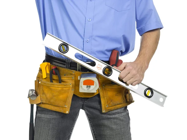 Construction worker with a level ruler — Stock Photo, Image