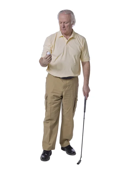 Old man golfer holding golf ball — Stock Photo, Image