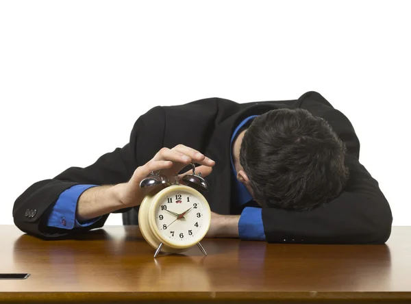 A sleeping businessman with alarm clock — Stock Photo, Image