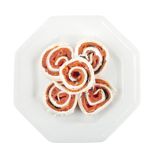 Overhead shot on a plate with smoked salmon rolls