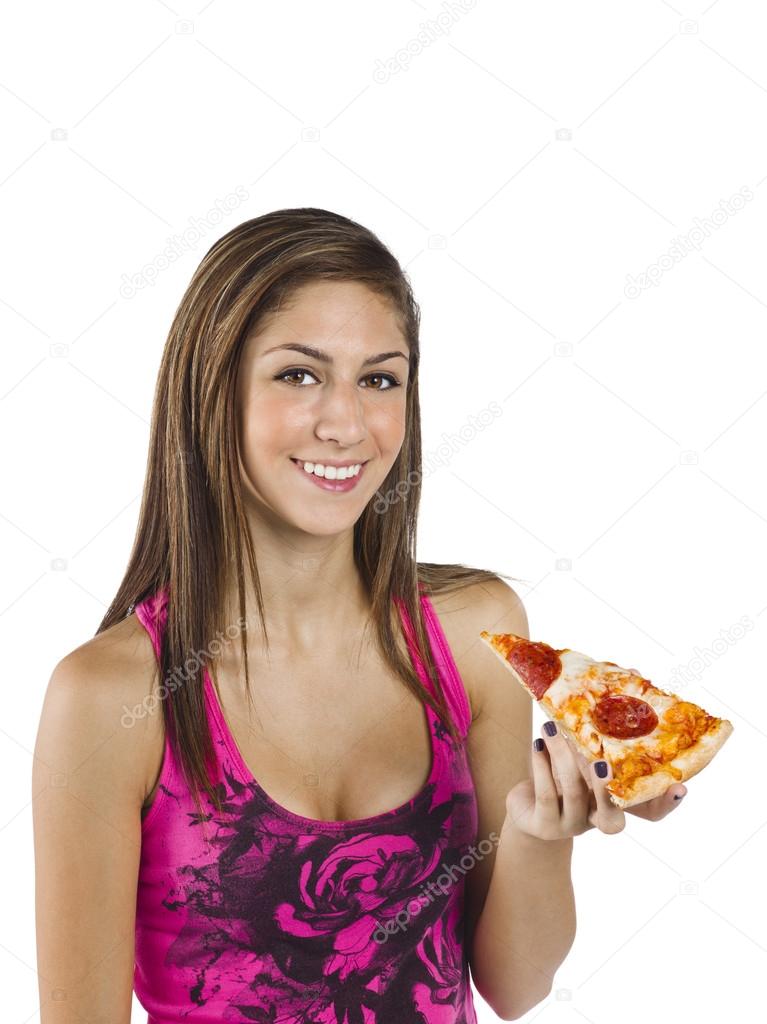 Portrait of a beautiful teenage girl holding a slice of pizza