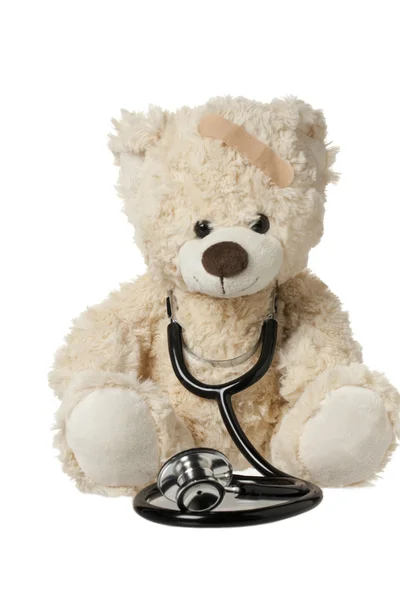 Cute teddy beer met een pleister en stethoscoop — Stockfoto