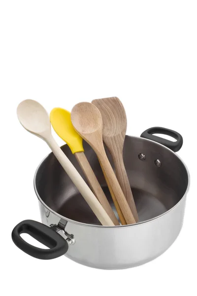 Saucepan with wooden spoons — Stock Photo, Image