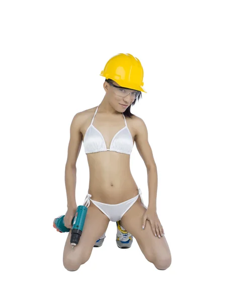 Trabalhador sexy com parafuso arma e capacete — Fotografia de Stock