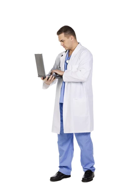 Young doctor working on a laptop — Stock Photo, Image