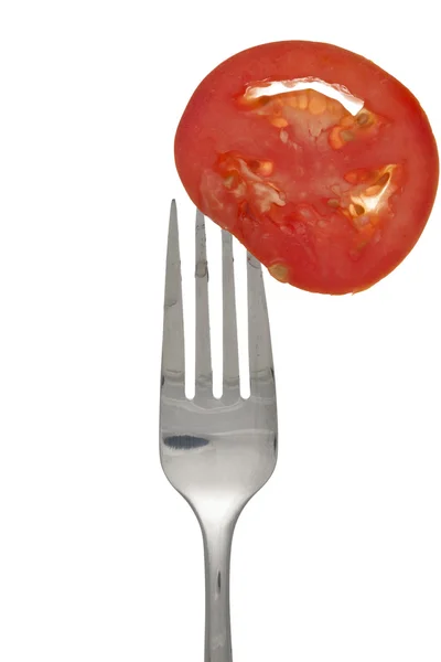 Garfo e tomate — Fotografia de Stock