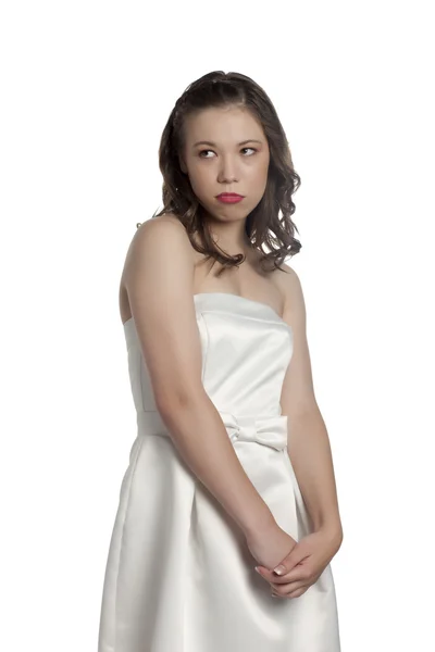 Frustrated teenage girl wearing white dress — Stock Photo, Image