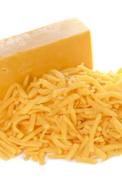 Grated bar of cheddar cheese — Stock Photo, Image