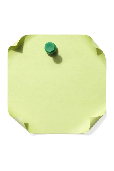 Grüne Stecknadel auf einem leeren Zettelpapier — Stockfoto